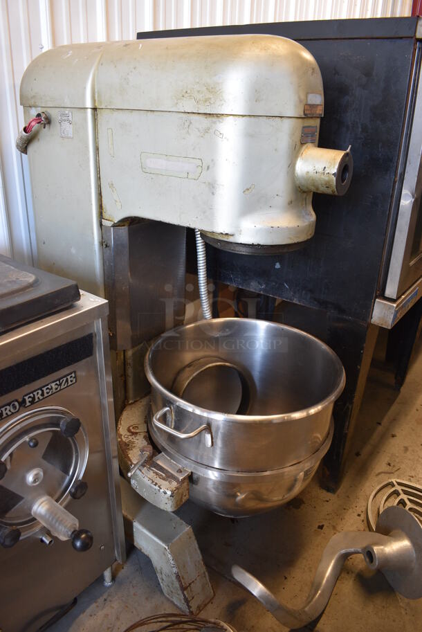 Hobart Model L800 Commercial Floor Style 80 Quart Mixer w/Stainless Steel Mixing Bowl and Dough Hook, Whisk, and Beater Paddle Attachments. Planetary Drive Shaft Needs Repaired. 220 Volt, 3 Phase. 29x41x56.