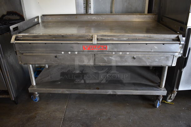 BEAUTIFUL! Vulcan Stainless Steel Commercial Flat Top Griddle w/ Thermostatic Controls and Metal Undershelf on Commercial Casters. 65x35x37 - Image 1 of 6