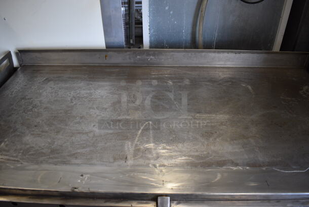 BEAUTIFUL! Vulcan Stainless Steel Commercial Flat Top Griddle w/ Thermostatic Controls and Metal Undershelf on Commercial Casters. 65x35x37 - Image 4 of 6