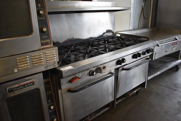GREAT! Stainless Steel Commercial Gas Powered 10 Burner Range w/ 2 Lower Ovens and Stainless Steel Overshelf. 61x34x59 - Image 2 of 6
