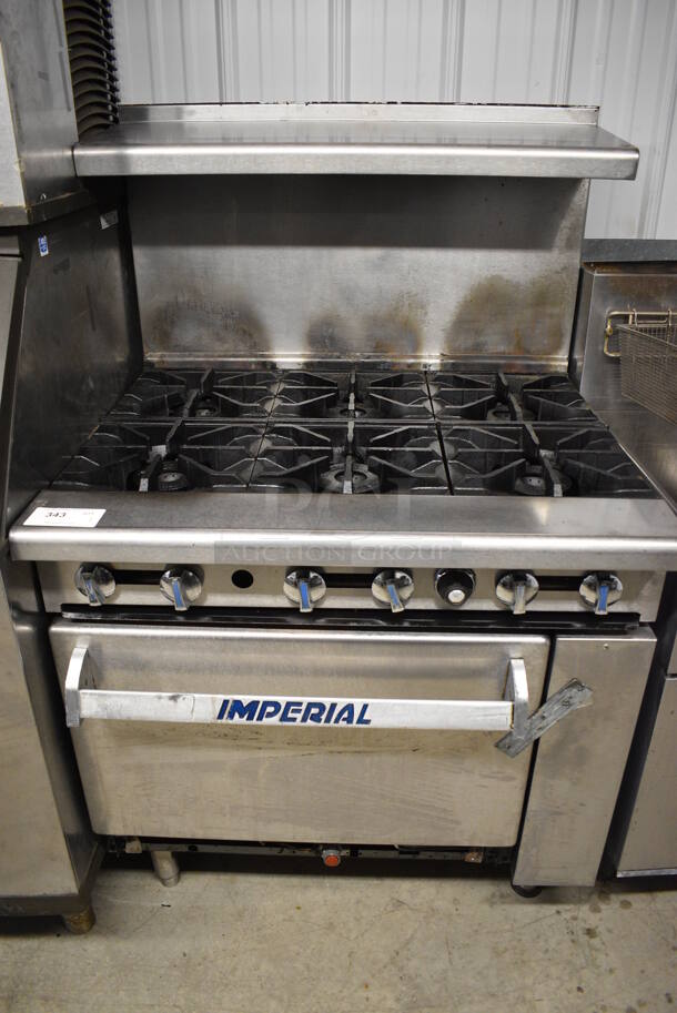 WOW! Imperial Stainless Steel Commercial Gas Powered 6 Burner Range w/ Lower Oven and Stainless Steel Overshelf. 36x32x57 - Image 1 of 6