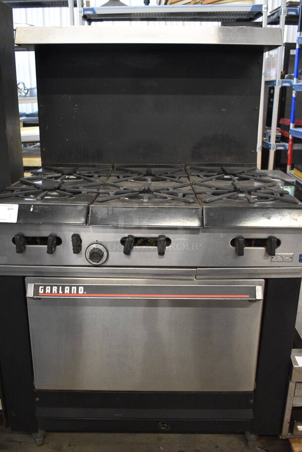 COOL! Garland Stainless Steel Commercial Gas Powered 6 Burner Range w/Lower Oven and Metal Over shelf. 36x31x59