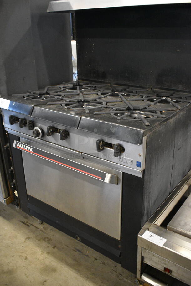 COOL! Garland Stainless Steel Commercial Gas Powered 6 Burner Range w/Lower Oven and Metal Over shelf. 36x31x59 - Image 3 of 6