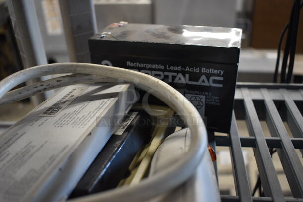 ALL ONE MONEY! Includes Surge Protector, Rechargeable Battery and Batter Charger. - Image 2 of 5