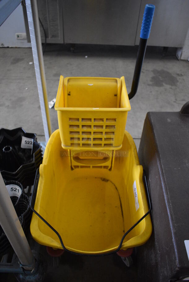 Yellow Poly Mop Bucket w/ Wringing Attachment on Casters. 15x25x34