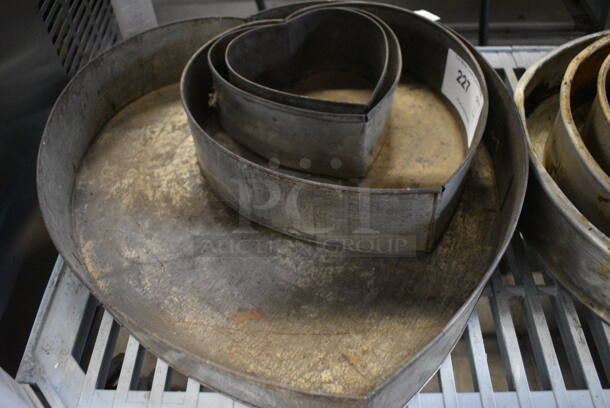 4 Various Metal Heart Shaped Nesting Baking Pans. 4 Times Your Bid!