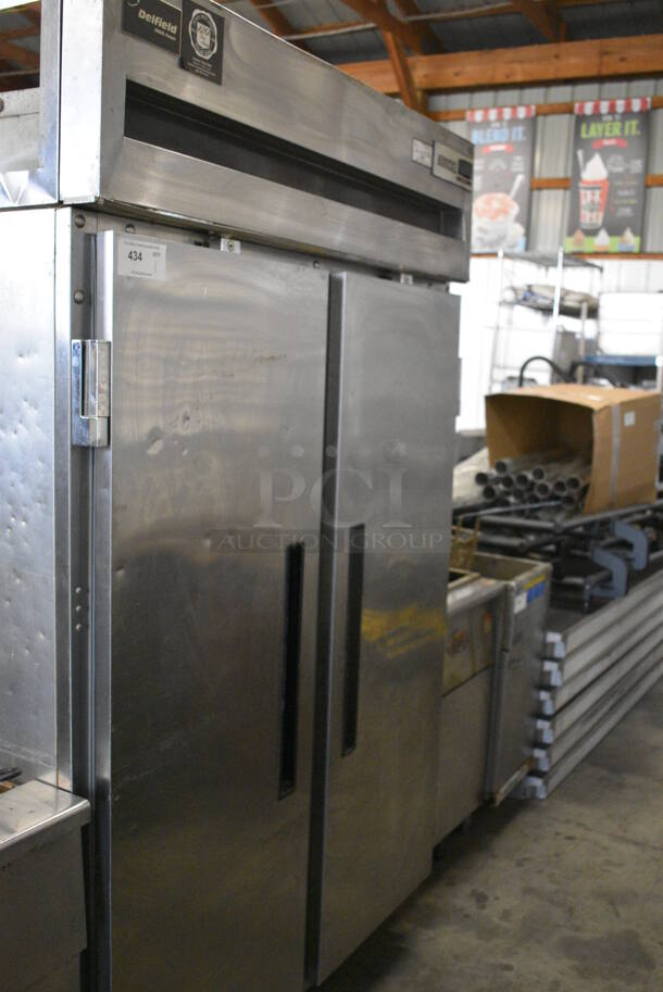 GREAT! Delfield Model 6151XL-S Stainless Steel Commercial 2 Door Reach In Freezer w/ Poly Coated Racks on Commercial Casters. 115 Volts, 1 Phase. 51x32x80. Tested and Working! - Image 1 of 6