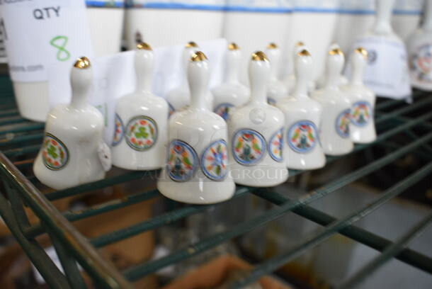 12 White Ceramic Bells. 1x1x2. 12 Times Your Bid!