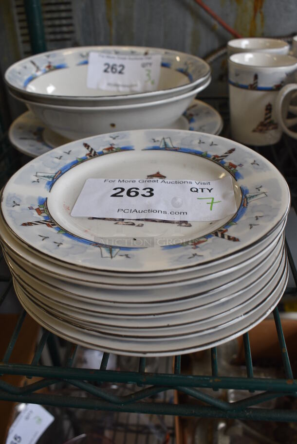 7 White Ceramic Plates w/ Lighthouse Design. 7x7x1. 7 Times Your Bid!