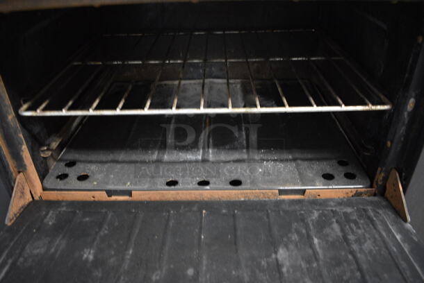 NICE! Garland Stainless Steel Commercial Gas Powered 6 Burner Range w/ Lower Oven and Stainless Steel Overshelf. 36x31x59 - Image 5 of 5