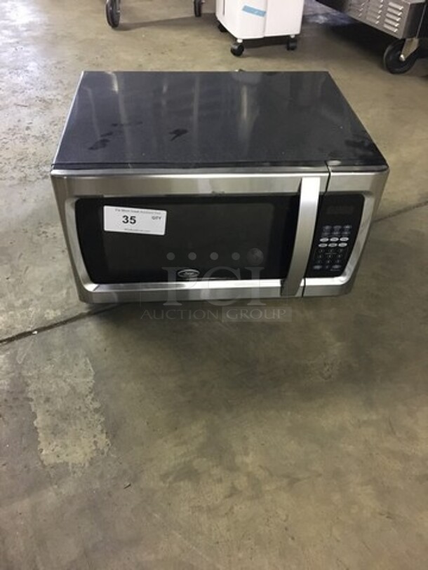 SWEET! Oster Countertop Microwave Oven! All Stainless Steel Body! With View Through Door! Model OGZF1301! 120V! Working When Removed!