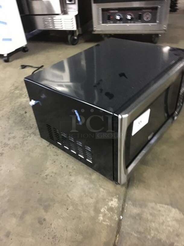 SWEET! Oster Countertop Microwave Oven! All Stainless Steel Body! With View Through Door! Model OGZF1301! 120V! Working When Removed! - Image 2 of 8