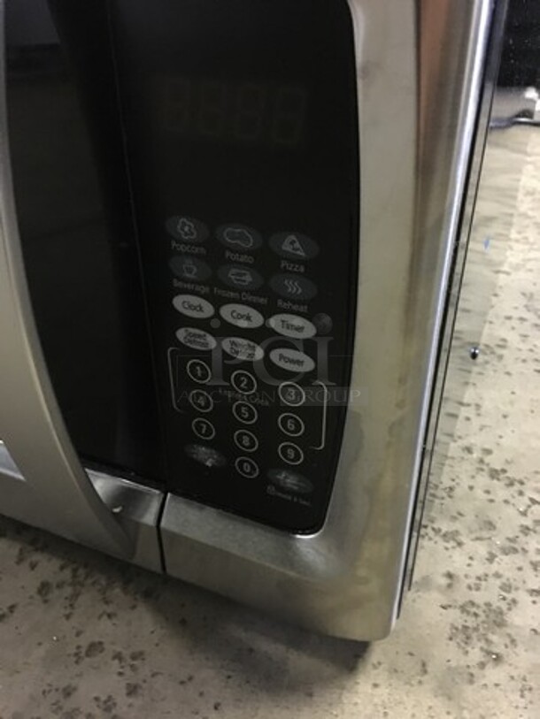 SWEET! Oster Countertop Microwave Oven! All Stainless Steel Body! With View Through Door! Model OGZF1301! 120V! Working When Removed! - Image 7 of 8