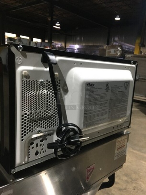 Oster Countertop Microwave Oven! With View Through Door! All Stainless Steel! Model OGZD0701! 120V 1Phase! - Image 4 of 8