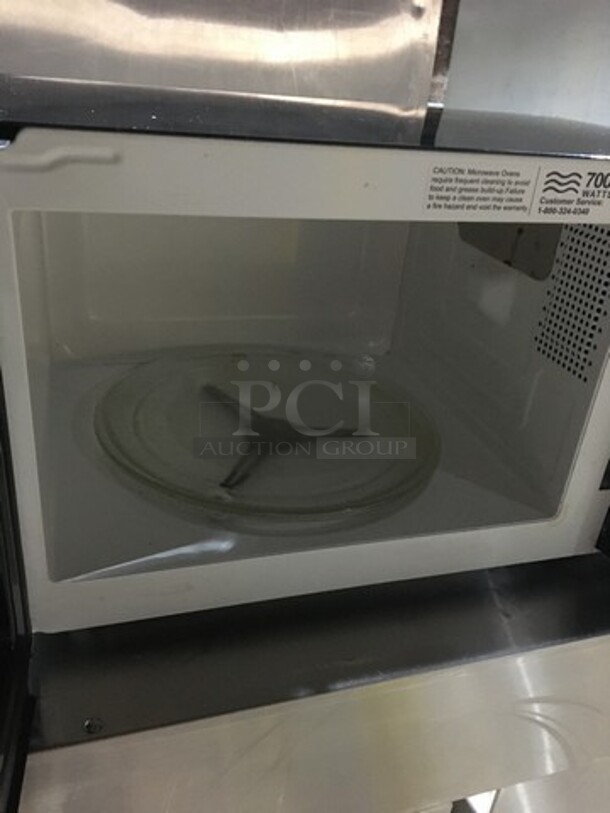 Oster Countertop Microwave Oven! With View Through Door! All Stainless Steel! Model OGZD0701! 120V 1Phase! - Image 6 of 8