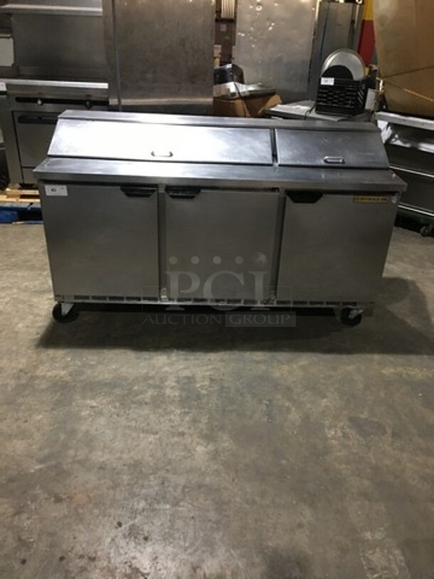 Beverage Air Commercial Refrigerated Sandwich Prep Table! With 3 Doors Underneath Storage Space! With Poly Coated Racks! All Stainless Steel! Model SPE7218 Serial 11010320! 115V 1Phase! On Casters!