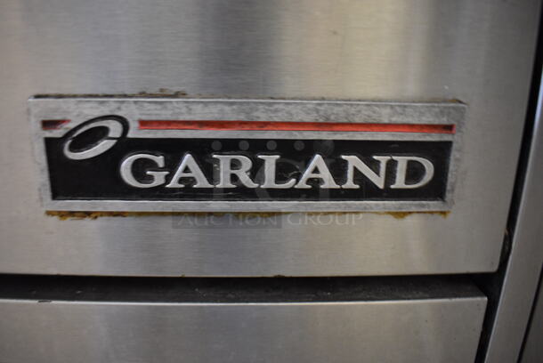 NICE! Garland Model H28 Stainless Steel Commercial Natural Gas Powered 4 Burner Range w/ Lower Oven on Commercial Casters. 24x33x45 - Image 7 of 10