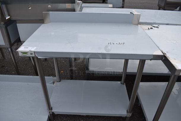 BRAND NEW SCRATCH AND DENT! Regency Stainless Steel Commercial Table w/ Undershelf and Backsplash. 36x24x38
