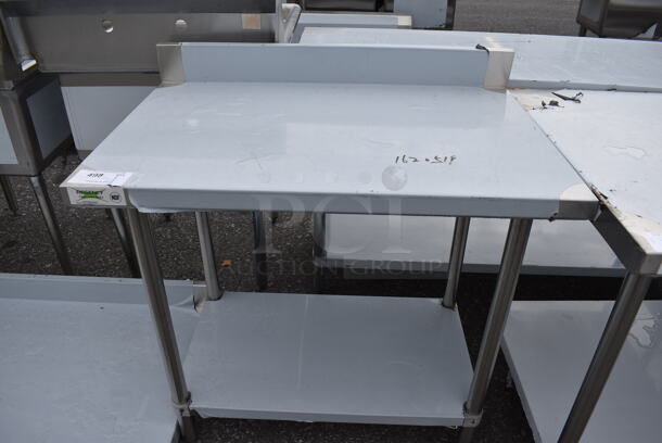 BRAND NEW SCRATCH AND DENT! Regency Stainless Steel Commercial Table w/ Undershelf and Backsplash. 36x24x38 - Image 1 of 3