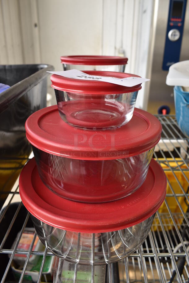 6 Glass Containers w/ 6 Red Lids. Includes 7.5x7.5x3.5. 6 Times Your Bid!