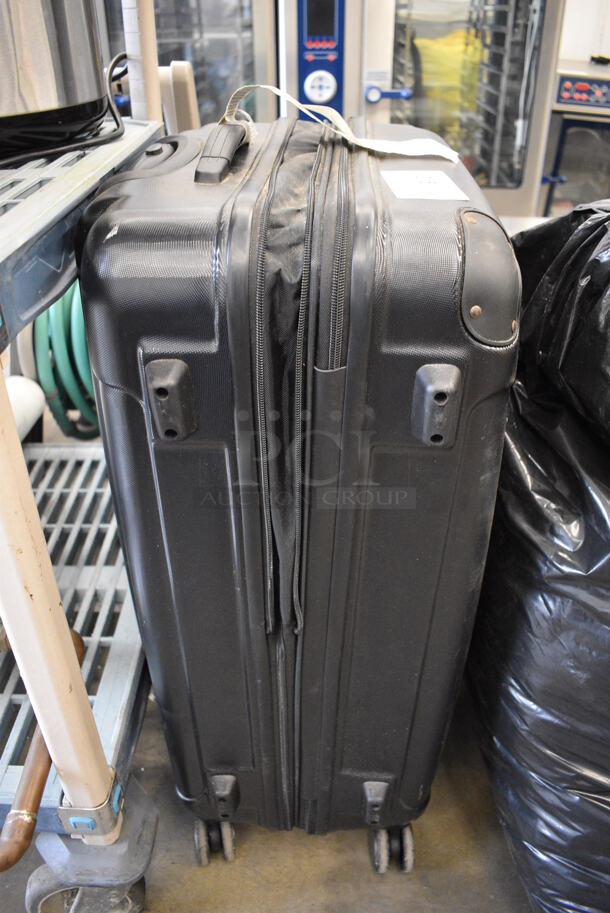 Black Suitcase on Casters. 12x19x29