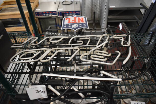 Bud Light Neon Light Up Sign. See Pictures For Damage. 27x6x22. Buyer Must Pick Up - We Will Not Ship This Item.