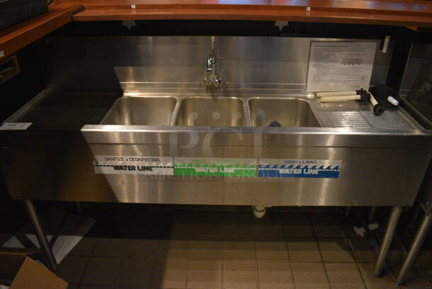 Stainless Steel Commercial 3 Bay Sink w/ Dual Drainboards, Faucet and Handles. BUYER MUST REMOVE. 60x18.5x38. Bays 10x14x9. Drainboards 13x16x1