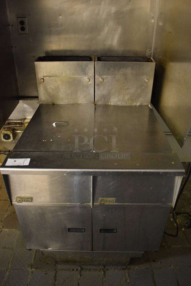 WOW! 2010 Pitco Frialator Model SG14 Stainless Steel Commercial Natural Gas Powered 2 Bay Deep Fat Fryer w/ Filtration System and 2 Lids on Commercial Casters. 110,000 BTU. BUYER MUST REMOVE. 31.5x31.5x46 - Image 1 of 7