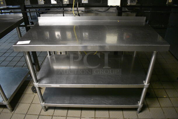 Stainless Steel Commercial Table w/ 2 Undershelves and Backsplash. 48x24x36.5 - Image 1 of 3