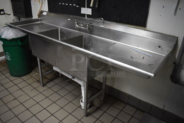 Stainless Steel Commercial 2 Bay Sink w/ Dual Drainboards, Faucet and Handles. BUYER MUST REMOVE. 88x26x41. Bays 20x20x12. Drainboards 22x22x2