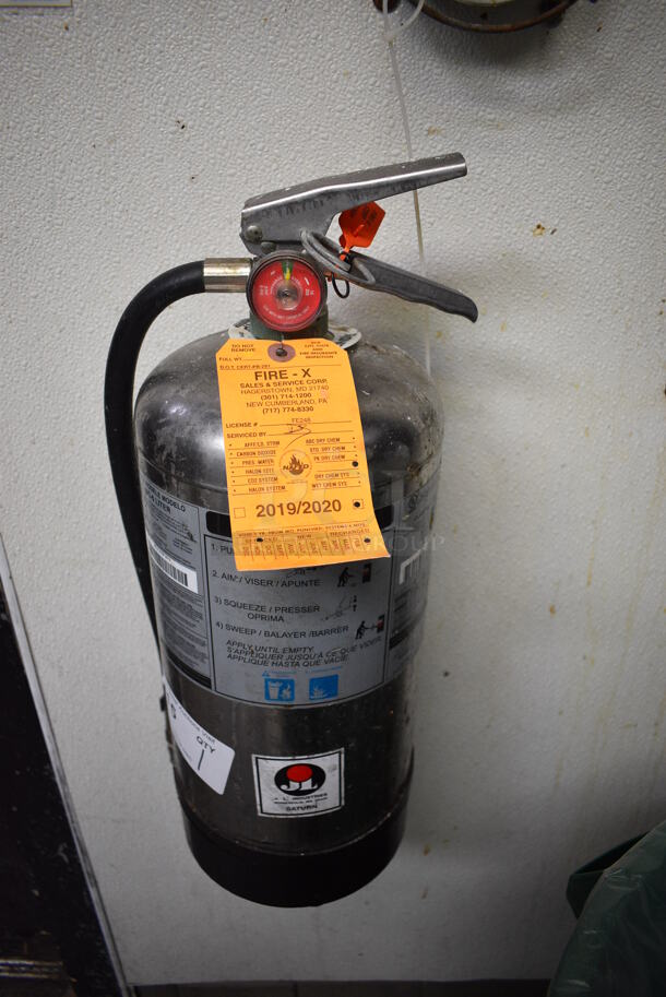 Metal Fire Extinguisher. BUYER MUST REMOVE. 7x8x19