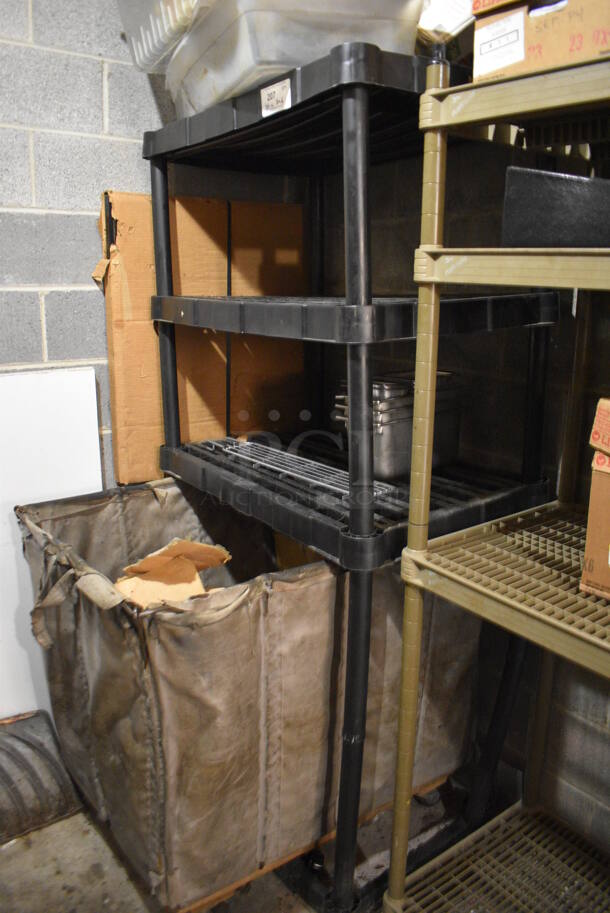 ALL ONE MONEY! Lot of 4 Tier Black Poly Metro Style Shelving Unit w/ Contents Including Poly Bin. 38x24x73. BUYER MUST DISMANTLE. PCI CANNOT DISMANTLE FOR SHIPPING. PLEASE CONSIDER FREIGHT CHARGES. - Image 1 of 3