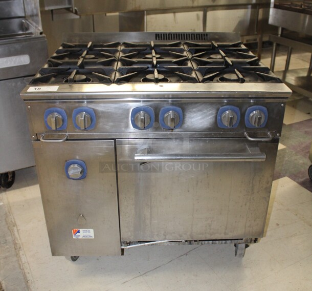 TERRIFIC! Electrolux Model ACFG36 Commercial Stainless Steel Natural Gas 6 Burner Range With Oven On Commercial Casters. 36x32.5x37. Working When Removed! 