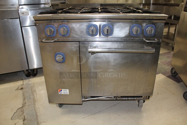 TERRIFIC! Electrolux Model ACFG36 Commercial Stainless Steel Natural Gas 6 Burner Range With Oven On Commercial Casters. 36x32.5x37. Working When Removed!  - Image 2 of 8