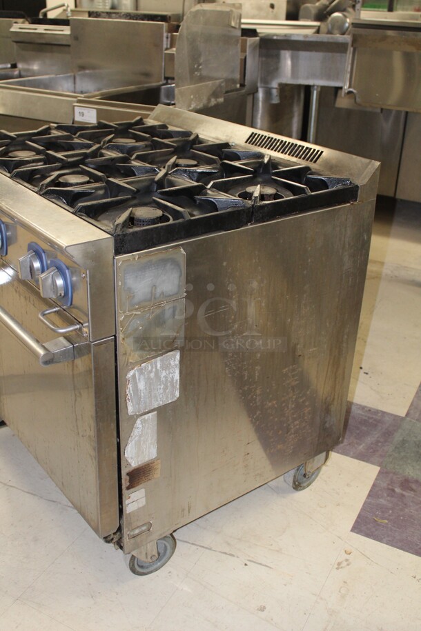 TERRIFIC! Electrolux Model ACFG36 Commercial Stainless Steel Natural Gas 6 Burner Range With Oven On Commercial Casters. 36x32.5x37. Working When Removed!  - Image 4 of 8