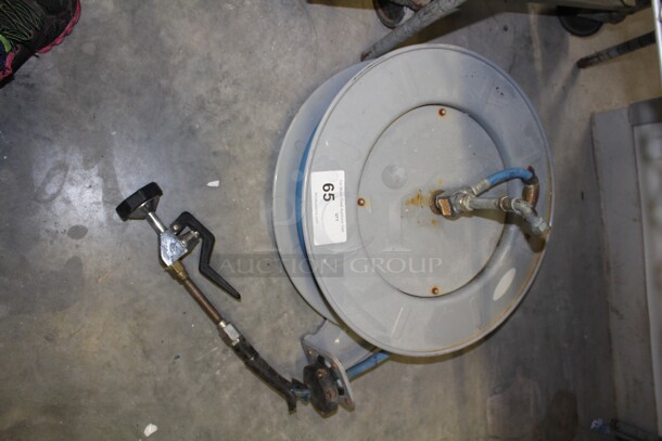Hose Reel With Hose And Sprayer.  - Image 1 of 2