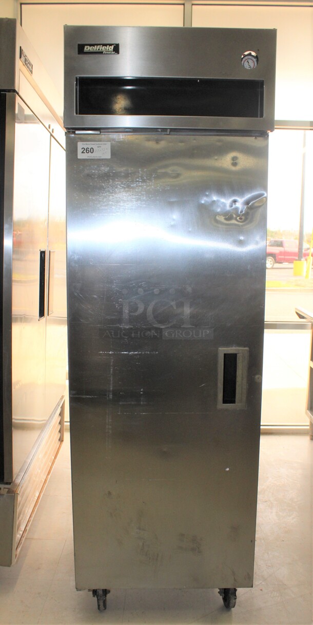 FABULOUS! Delfield Model 6125-S Commercial Stainless Steel Single Door Reach In Freezer On Commercial Casters. 25.5x32x79.5. 115V/60Hz. Working When Removed! 