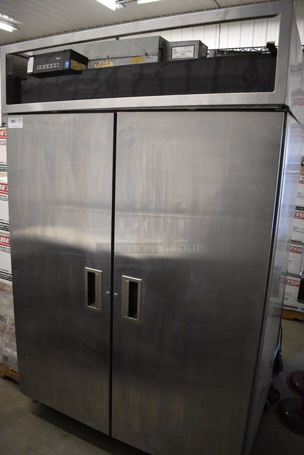 NICE! Delfield Model 6051-S Stainless Steel Commercial 2 Door Reach In Cooler w/ Poly Coated Racks on Commercial Casters. 115 Volts, 1 Phase. 51x33x79. Tested and Powers On But Temps at 54 Degrees