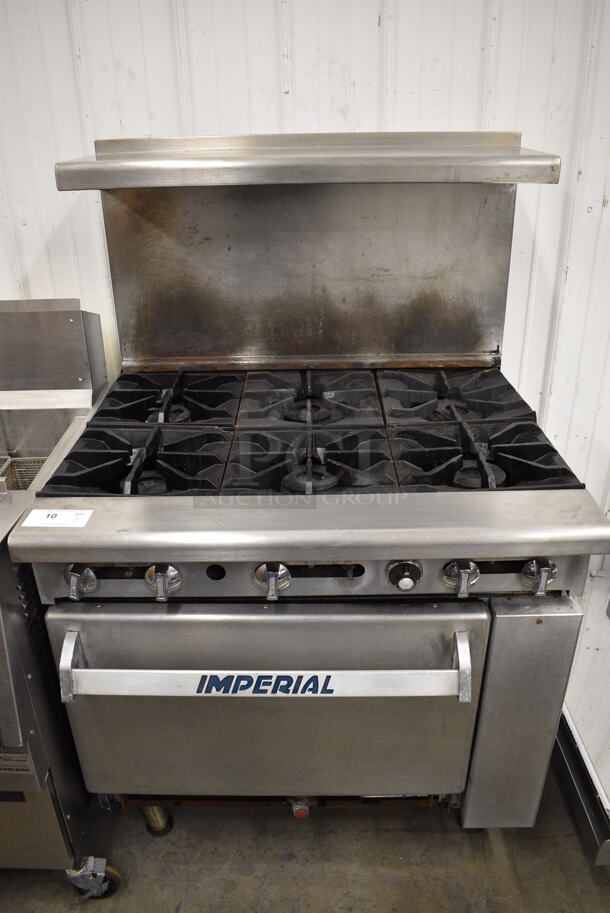 WONDERFUL! Imperial Stainless Steel Commercial Gas Powered 6 Burner Range w/ Lower Oven and Stainless Steel Overshelf. 36x31x57