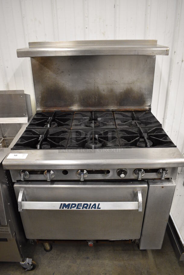 WONDERFUL! Imperial Stainless Steel Commercial Gas Powered 6 Burner Range w/ Lower Oven and Stainless Steel Overshelf. 36x31x57 - Image 1 of 8
