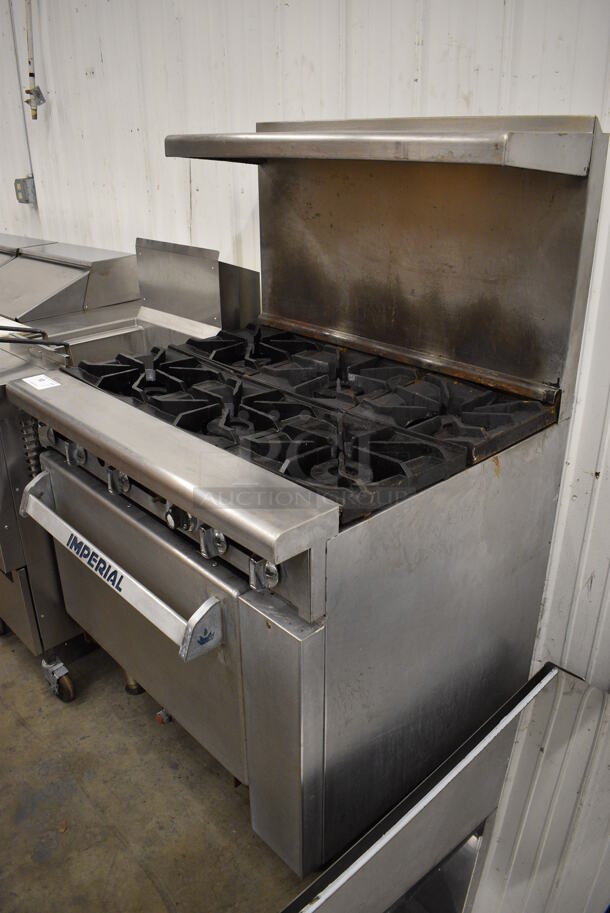 WONDERFUL! Imperial Stainless Steel Commercial Gas Powered 6 Burner Range w/ Lower Oven and Stainless Steel Overshelf. 36x31x57 - Image 2 of 8