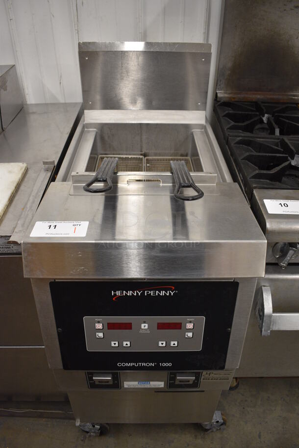 BEAUTIFUL! 2018 Henny Penny Model OFG-321 Stainless Steel Commercial Floor Style Natural Gas Powered Deep Fat Fryer w/ 2 Metal Fry Baskets on Commercial Casters. 85,000 BTU. 17x34x44