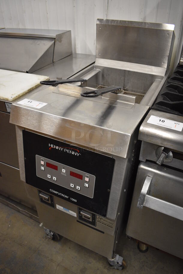BEAUTIFUL! 2018 Henny Penny Model OFG-321 Stainless Steel Commercial Floor Style Natural Gas Powered Deep Fat Fryer w/ 2 Metal Fry Baskets on Commercial Casters. 85,000 BTU. 17x34x44 - Image 2 of 7