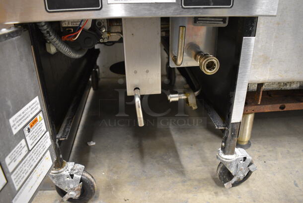 BEAUTIFUL! 2018 Henny Penny Model OFG-321 Stainless Steel Commercial Floor Style Natural Gas Powered Deep Fat Fryer w/ 2 Metal Fry Baskets on Commercial Casters. 85,000 BTU. 17x34x44 - Image 6 of 7
