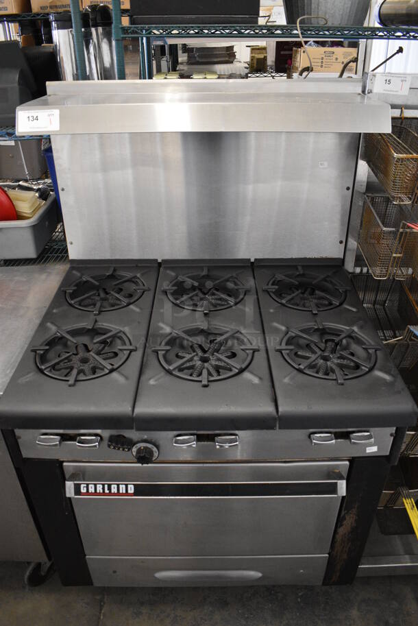 WOW! Garland Metal Commercial Gas Powered 6 Burner Range w/ Lower Oven and Stainless Steel Overshelf. 36x31x60