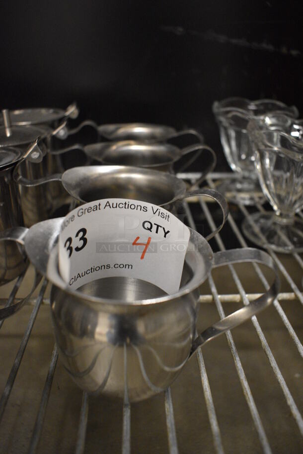 4 Metal Pitchers. 4.5x3x3. 4 Times Your Bid! - Image 1 of 2