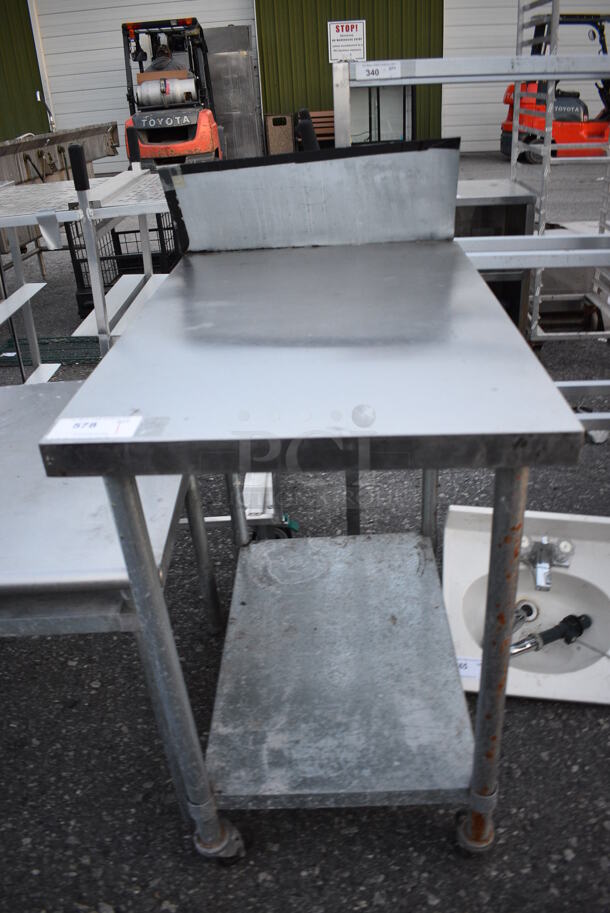 Stainless Steel Commercial Table w/ Metal Undershelf and Backsplash on Commercial Casters. 24x36x48