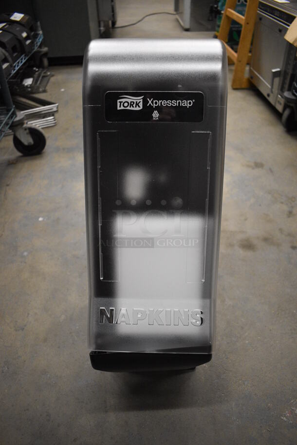 Tork Xpressnap Black and Clear Poly Countertop Napkin Dispenser. 8x8x22