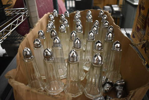 34 Salt and Pepper Shakers. 2x2x4.5. 34 Times Your Bid!