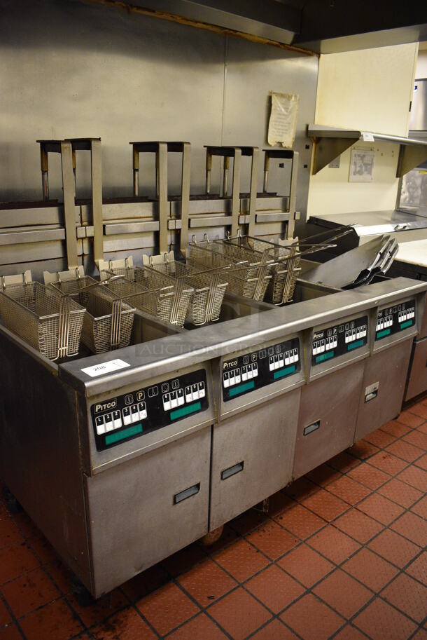 GORGEOUS! Pitco Frialator Stainless Steel Commercial Floor Style Gas Powered 4 Bay Deep Fat Fryer w/ Filtration System, 8 Metal Fry Baskets and 4 Metal Lids on Commercial Casters. 110,000 BTU. 62.5x39x55. Unit Was Working When Restaurant Closed!